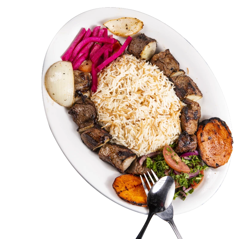 Flaming Kabob Oval plate with grilled meat skewers, rice, grilled vegetables, pickled pink turnips, and a side salad with a fork and spoon. Perfect for your menu's description to enhance SEO keywords. Commerce TWP, MI